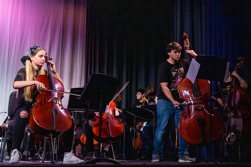 Orchestra students perform onstage